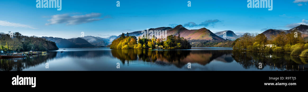 Panoramic view of Derwentwater in the Lake District National Park with a view of Catbells and Derwent Isle across the lake at sunrise Stock Photo