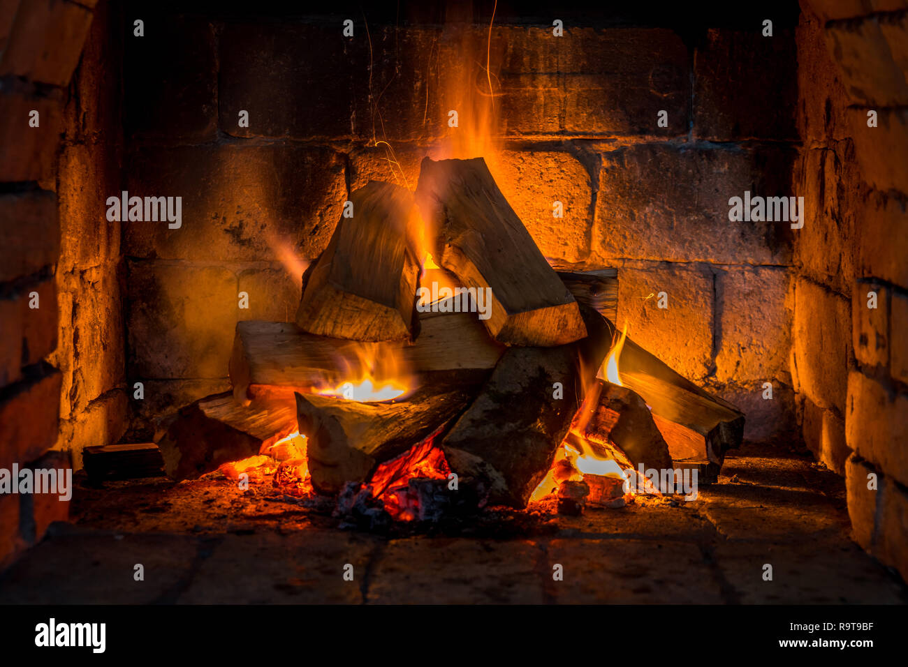Wood Burning In A Cozy Fireplace At Home Keep Warm Stock Photo