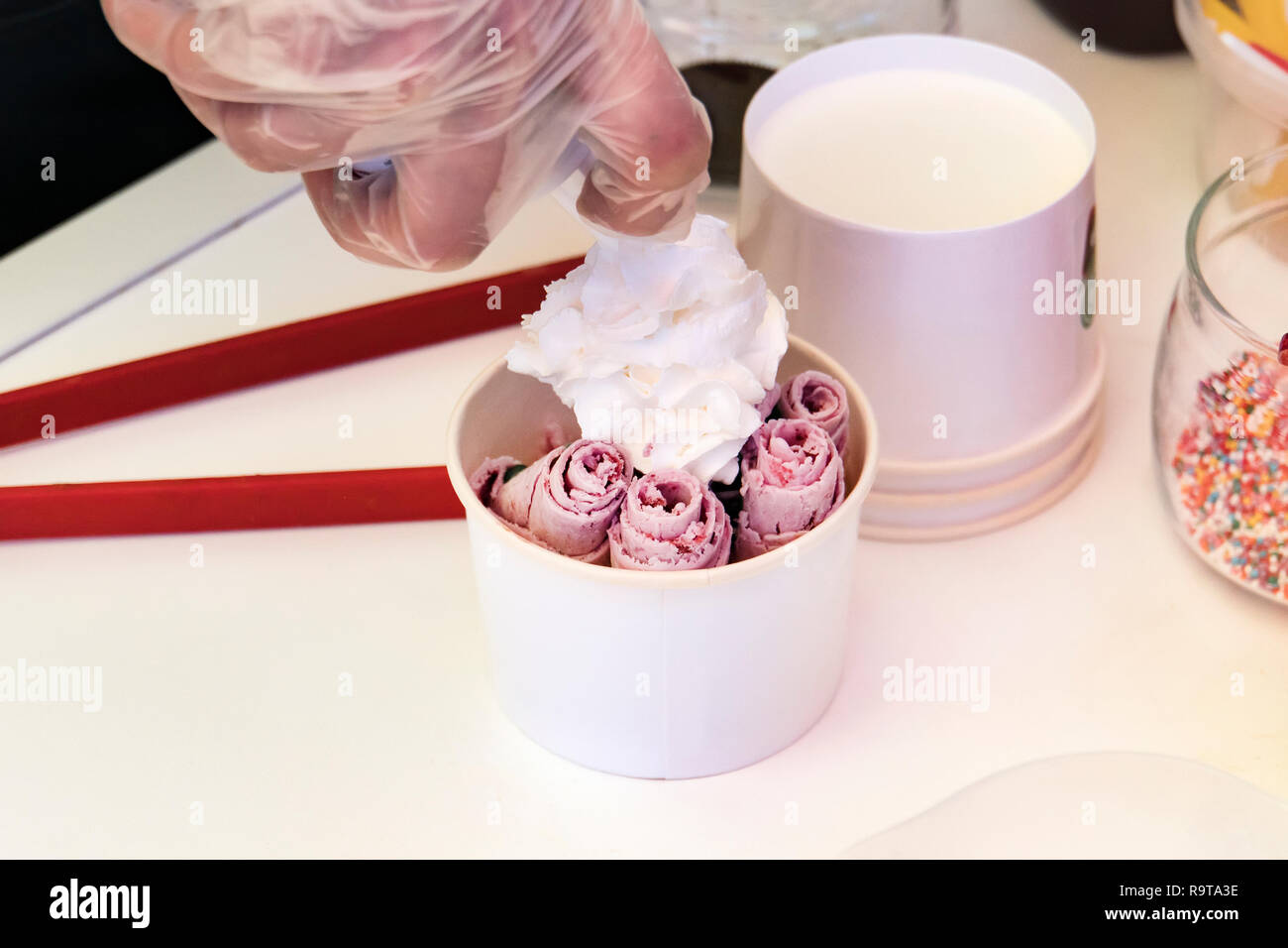 Stir-fried ice cream rolls at freeze pan. Rolled ice cream, hand made ice  cream dessert. Stir-fried ice-cream from milk and berry jam. Fried machine  w Stock Photo - Alamy