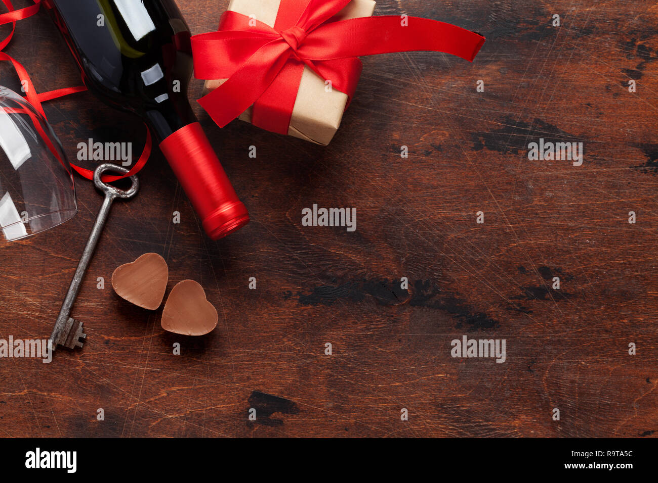 Valentines day greeting card with wine bottle, chocolate hearts, key ...