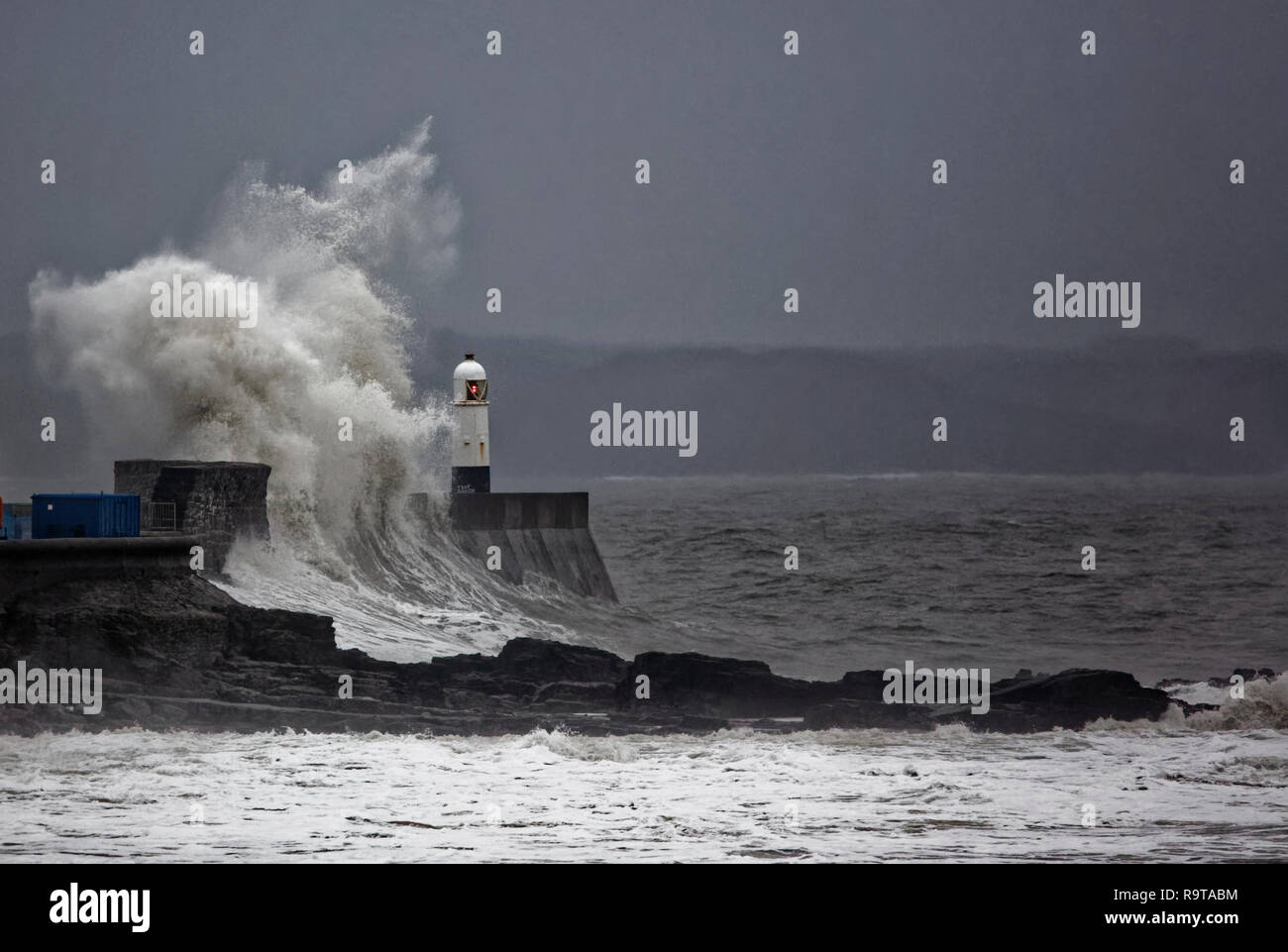 WEATHER PICTURE WALES Pictured: Waves crash against the promenade wall by the lighthouse in Porthcawl, south Wales, UK. Tuesday 18 December 2018 Re: H Stock Photo