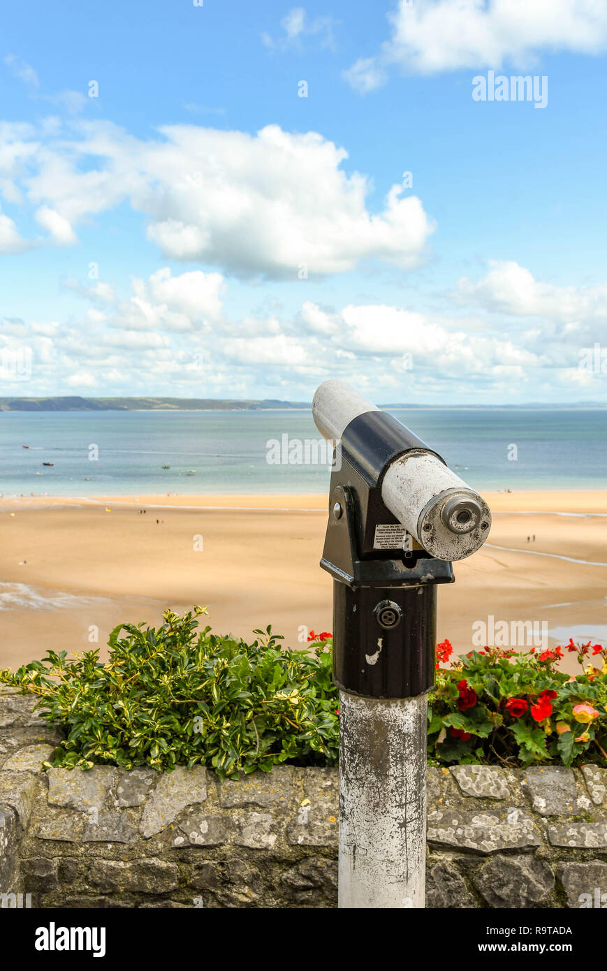 TENBY, PEMBROKESHIRE, WALES - AUGUST 2018: Coin-operated binoculars for visitors to view the scenery in Tenby, West Wales. Stock Photo