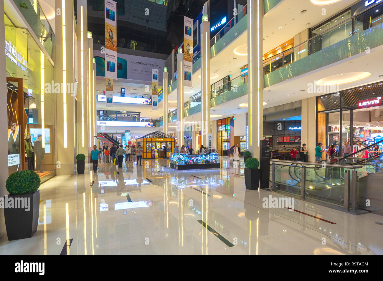 DUBAI, UAE - NOV 12, 2018: shoppers in Dubai Mall, the world's largest shopping mall based on total area and sixth largest by gross leasable area Stock Photo