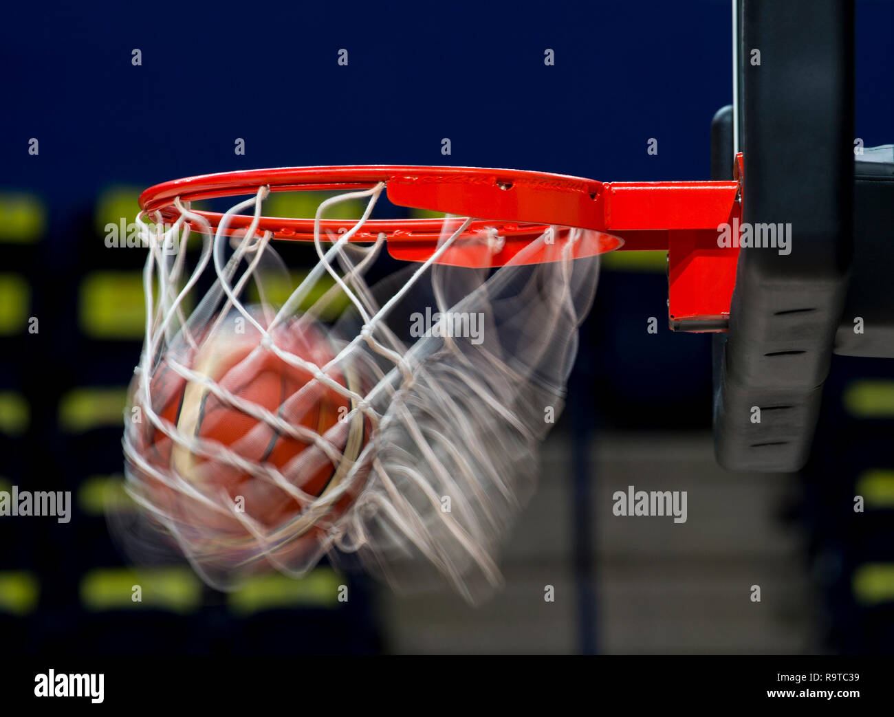 scoring during a basketball game ball in hoop Stock Photo Alamy