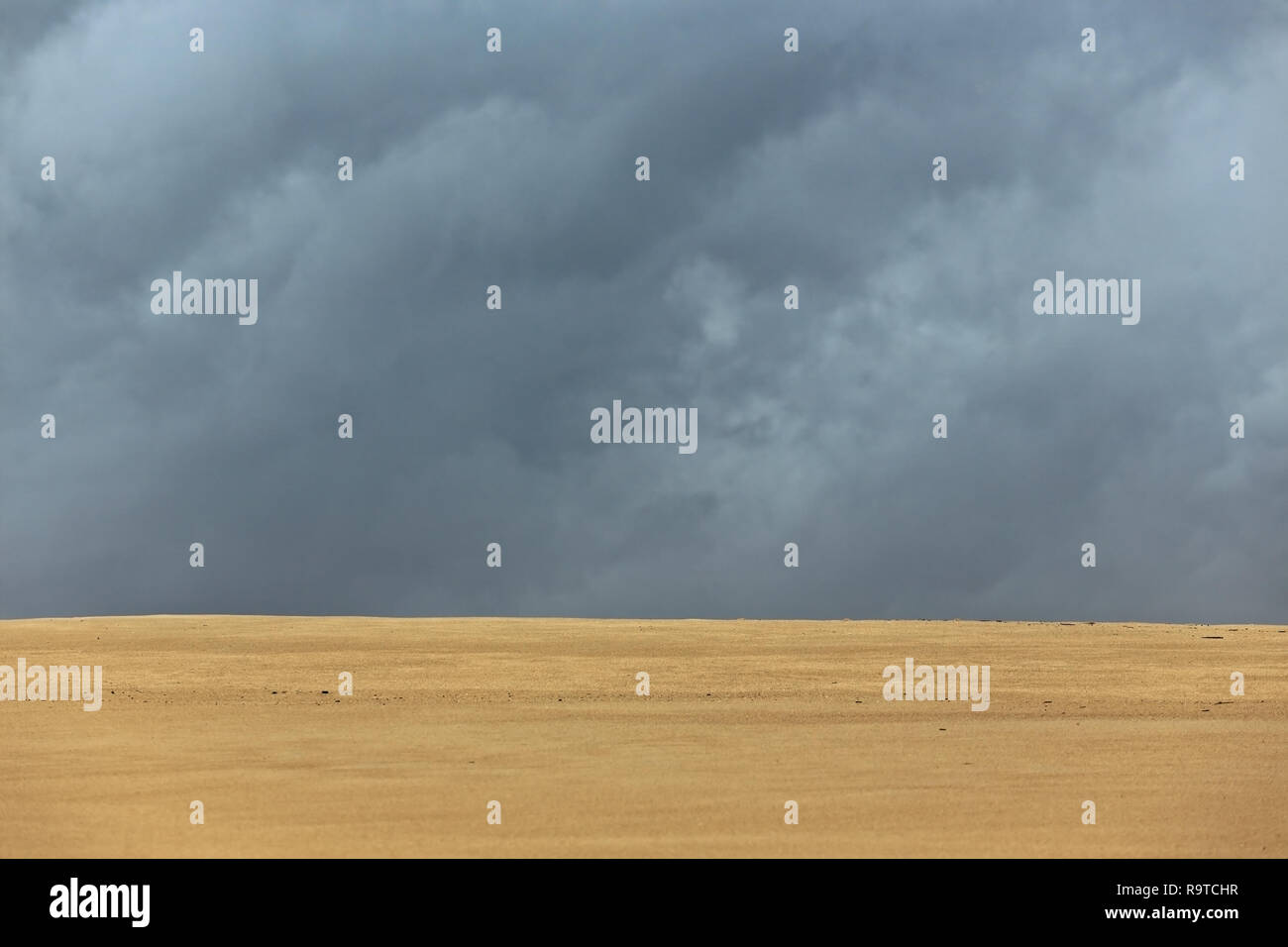 Empty beach in an overcast day Stock Photo