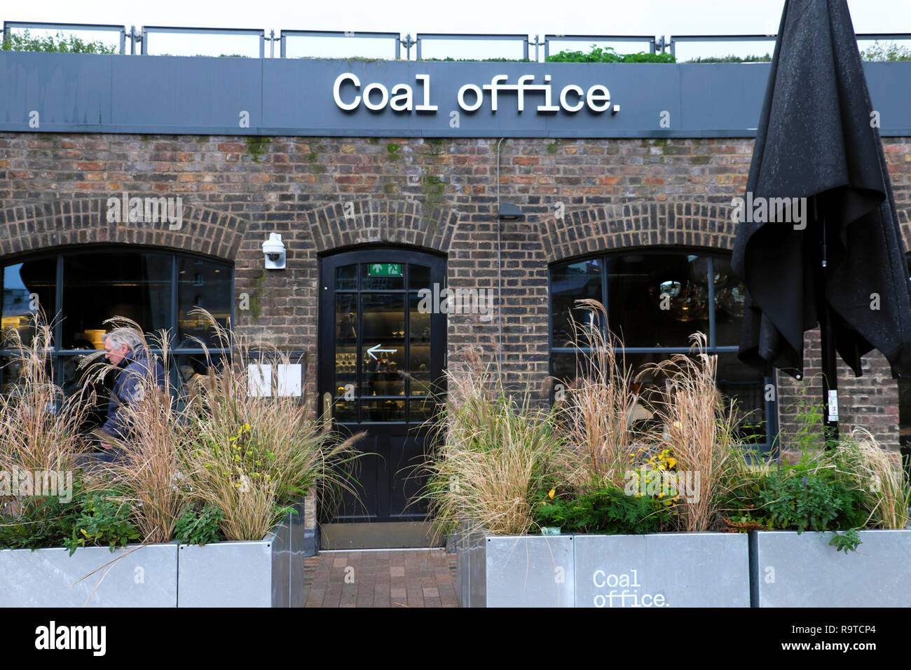 Coal Office Restaurant serving Middle Eastern food entrance exterior view and sign at Coal Drops Yard  Kings Cross London UK  KATHY DEWITT Stock Photo