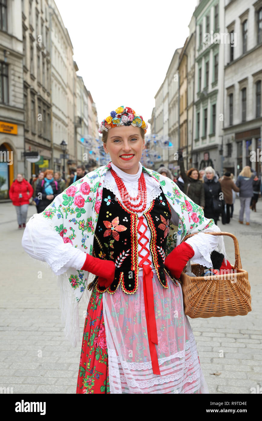 Polish lady in traditional costume, on Market Square in Krakow's Old Town, in Poland Stock Photo