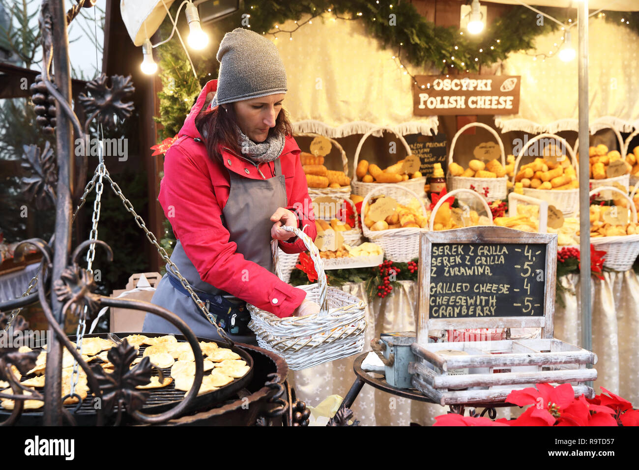 Smoked cheese stall on the Christmas market in the Main Market Square, in the Old Town in Krakow, Poland Stock Photo