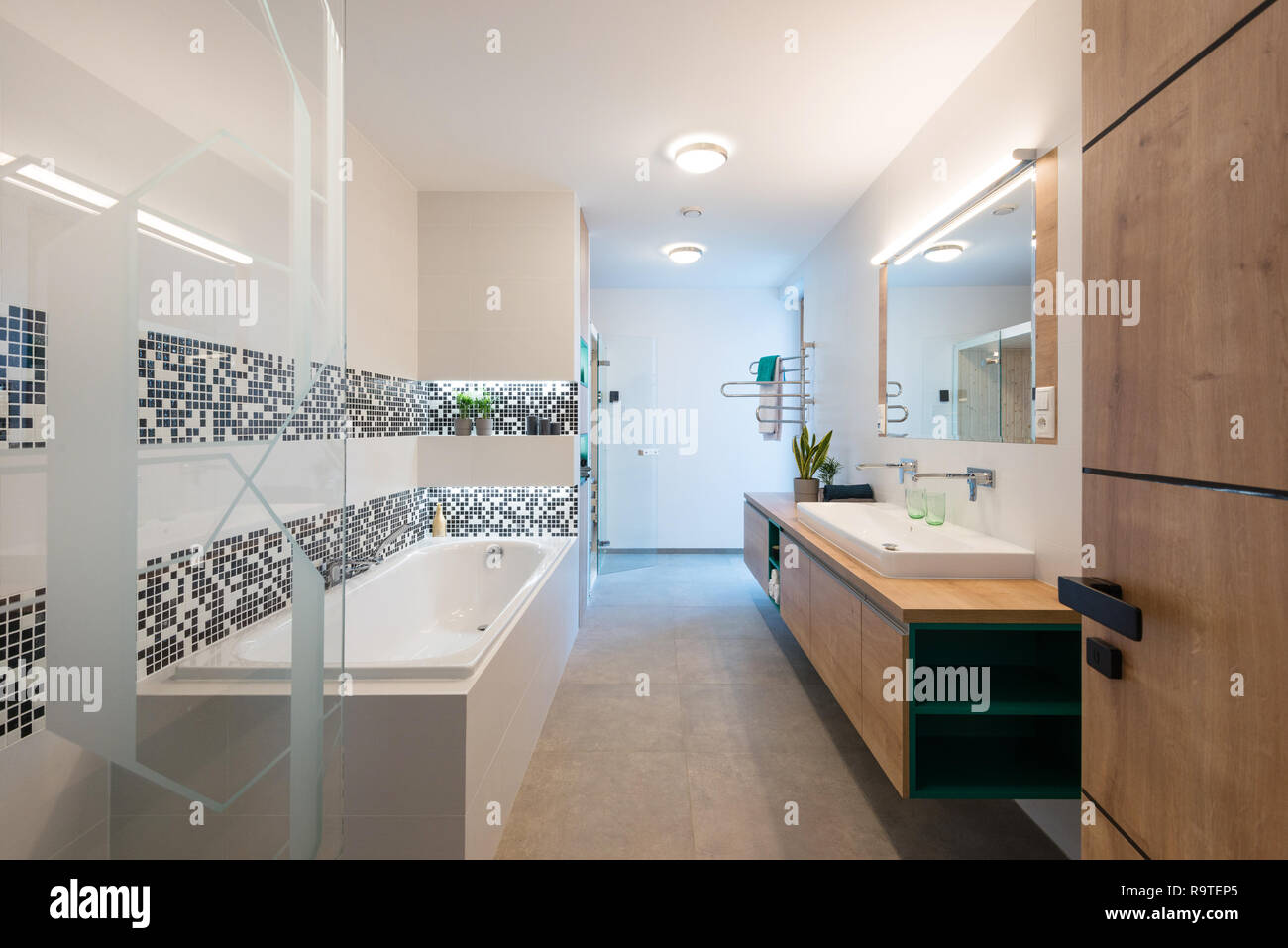 Interior of modern bathroom with bathtub and shower Stock Photo Alamy