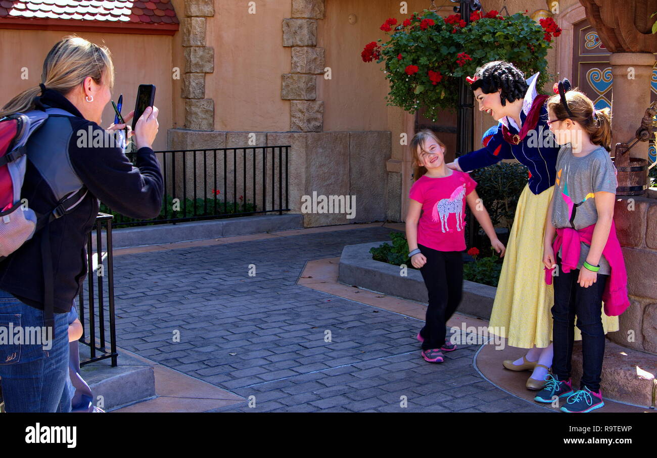 Orlando, FL USA. Feb 2016. Snow White preparing a photo shoot for mom at Disney World. Stock Photo