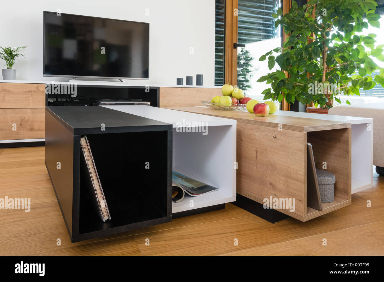 Custom table in modern living room Stock Photo - Alamy