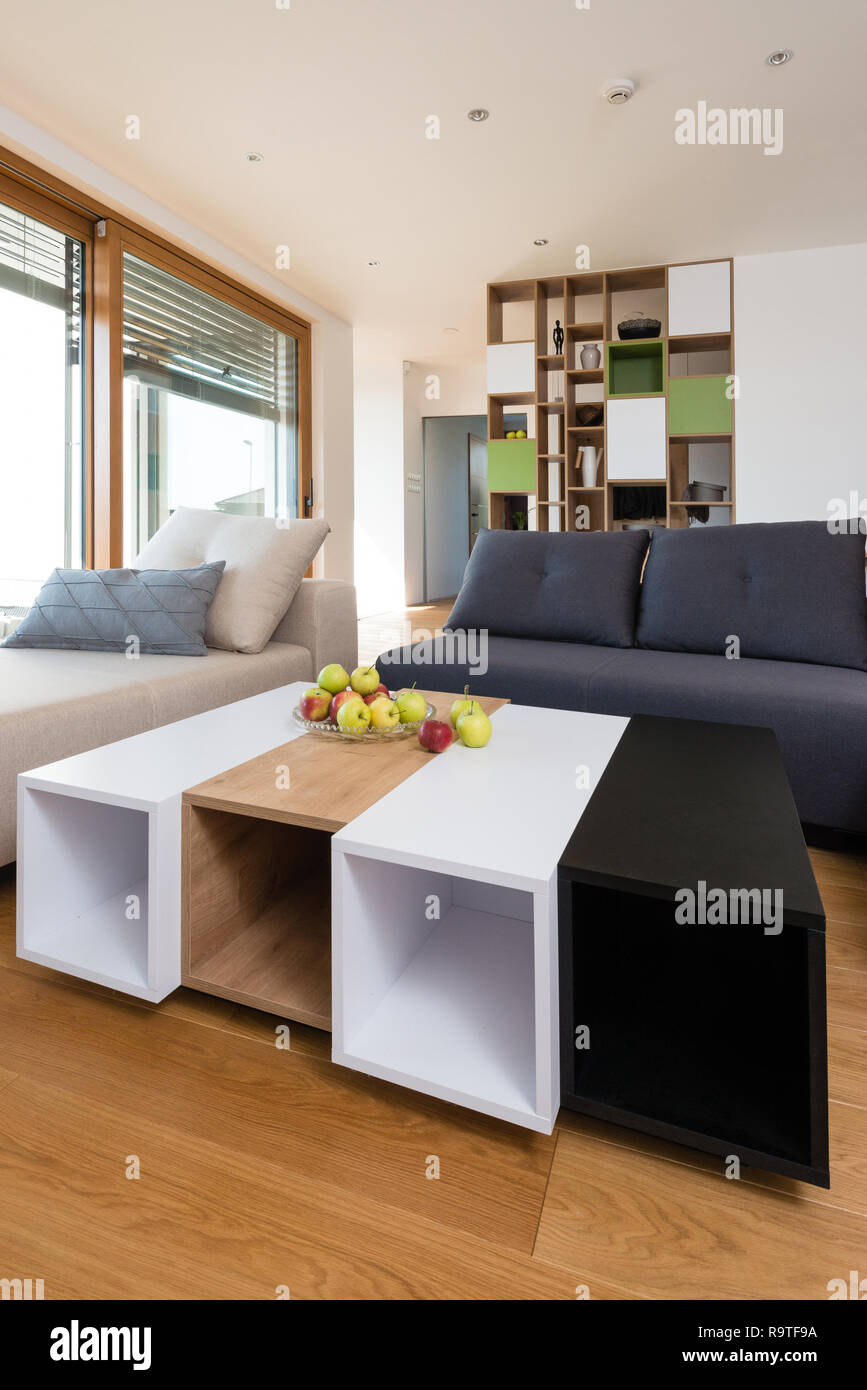 Custom table in modern living room Stock Photo - Alamy