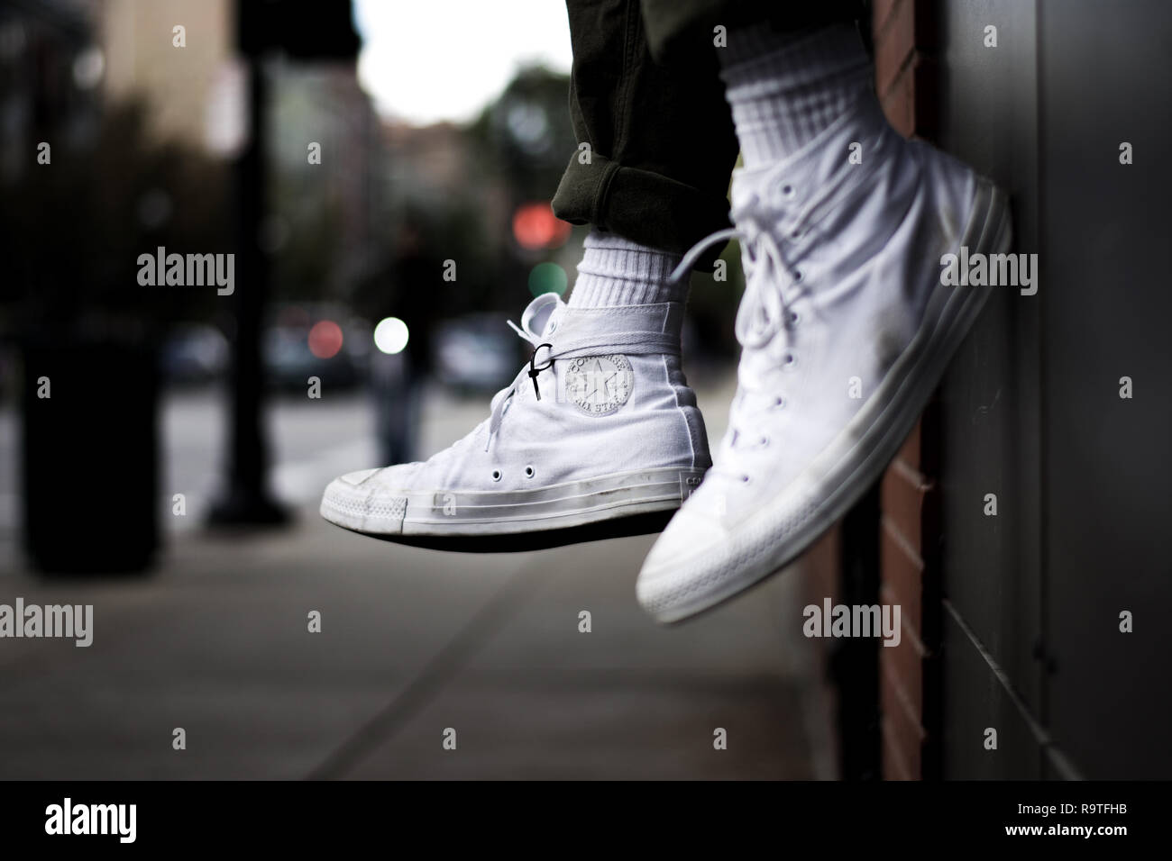 White Chuck Taylors in the city Stock Photo