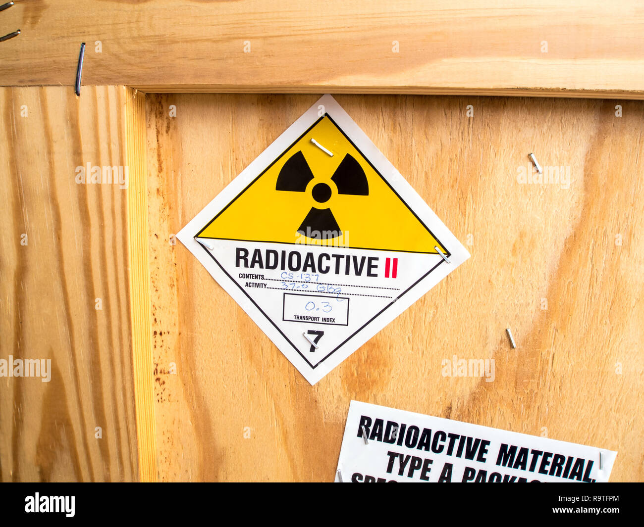Radioactive material label beside the transportation wooden box Type A