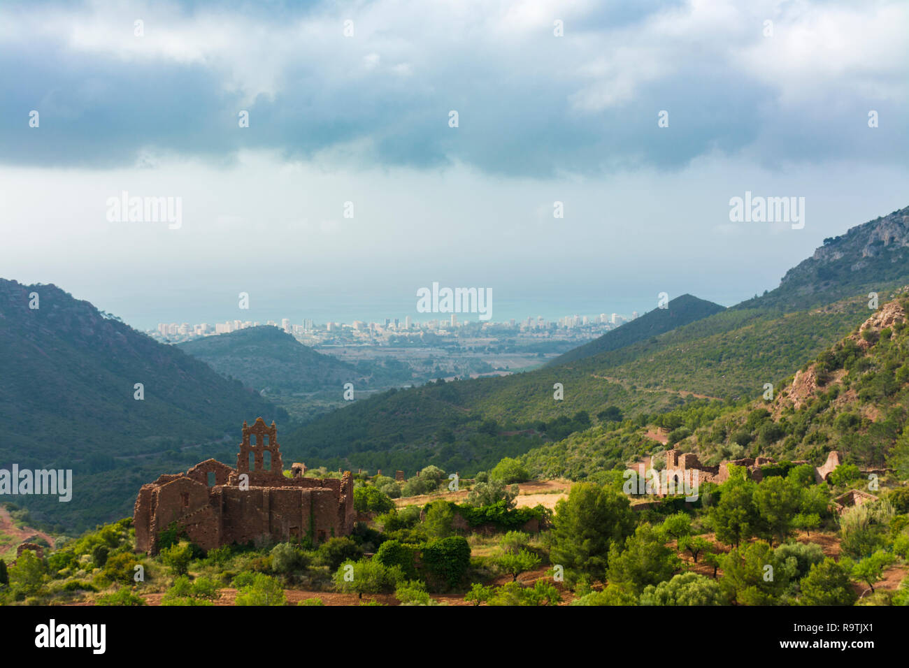 https://c8.alamy.com/comp/R9TJX1/ruins-of-the-carmelite-convent-of-benicassim-castellon-spain-with-the-town-and-beach-at-background-national-park-of-desierto-de-las-palmas-R9TJX1.jpg