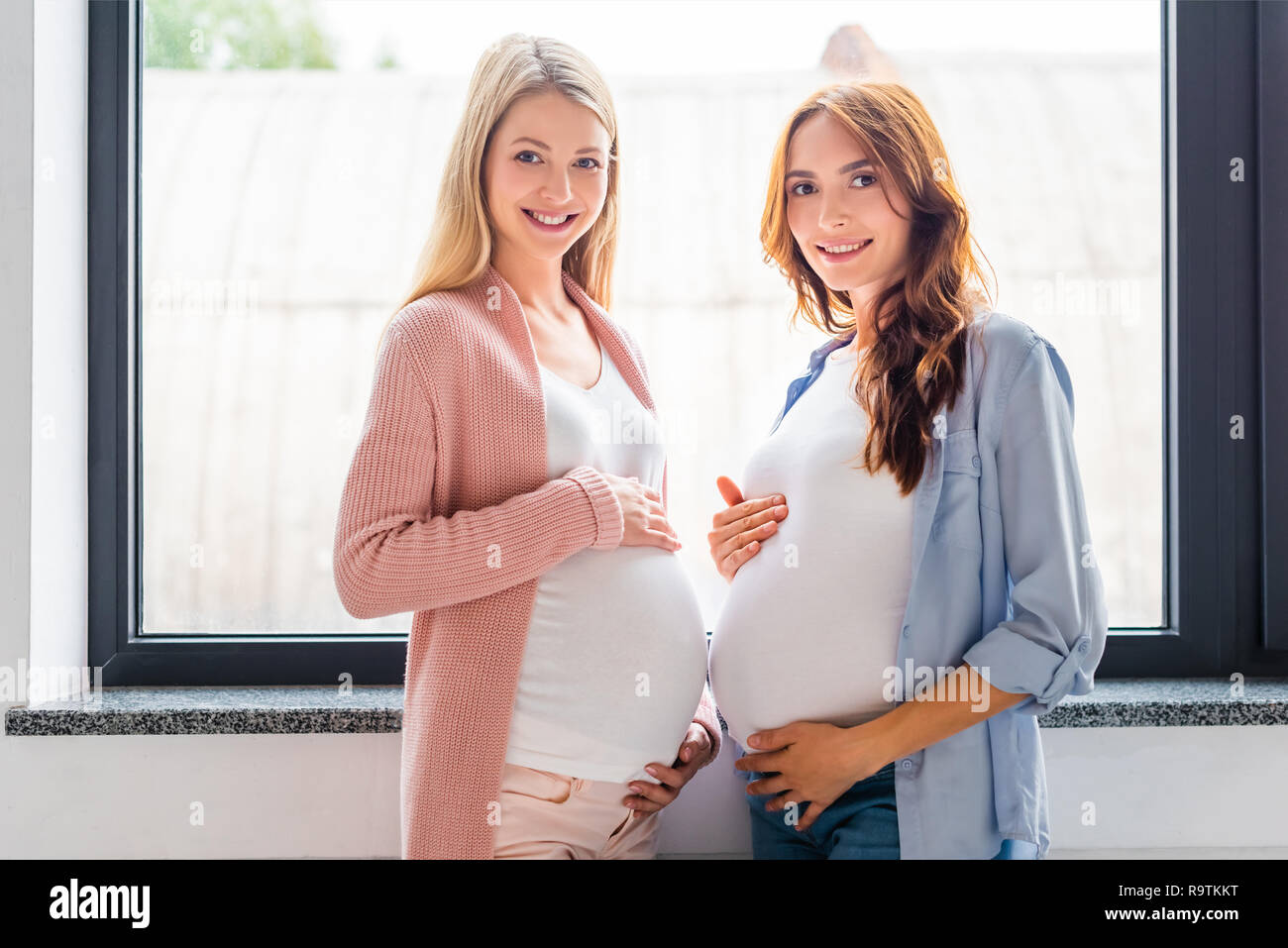 Blonde pregnant female standing hi-res stock photography and images - Alamy