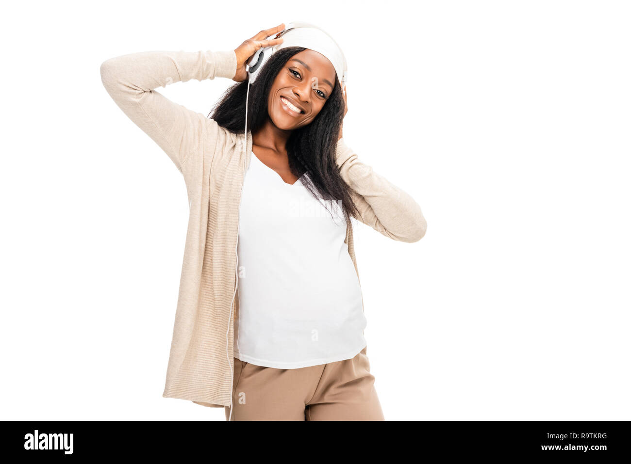Smiling pregnant woman listening hi-res stock photography and images ...