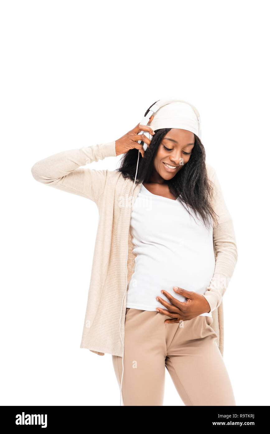 african american pregnant woman listening music isolated on white Stock ...