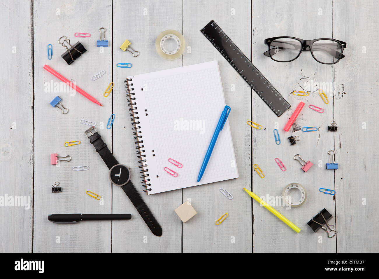 workplace with notepad, glasses, watch, pen etc. Stock Photo