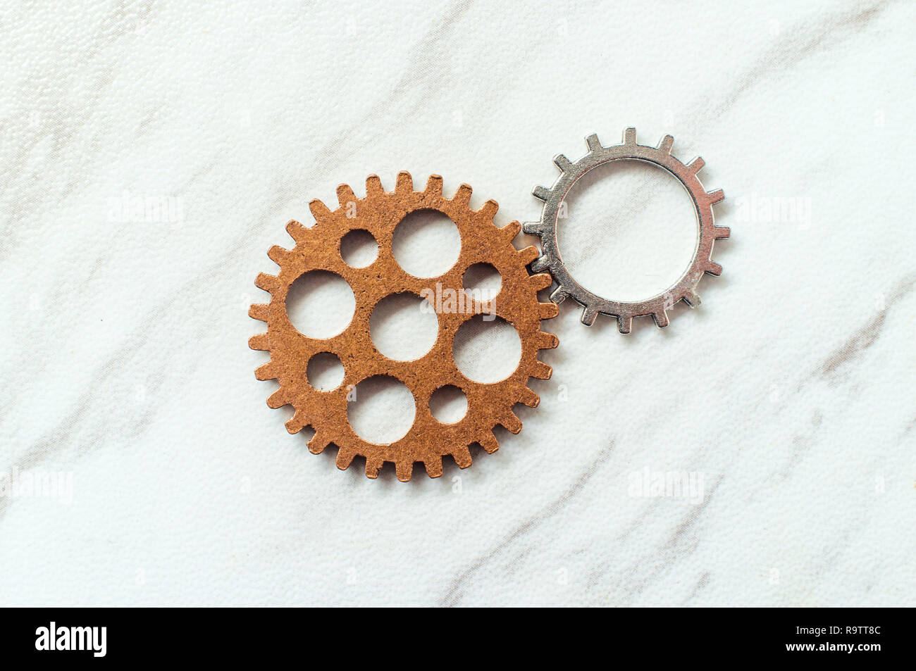 Two gears in motion symbolic of inspiration metaphor concept Stock Photo Alamy