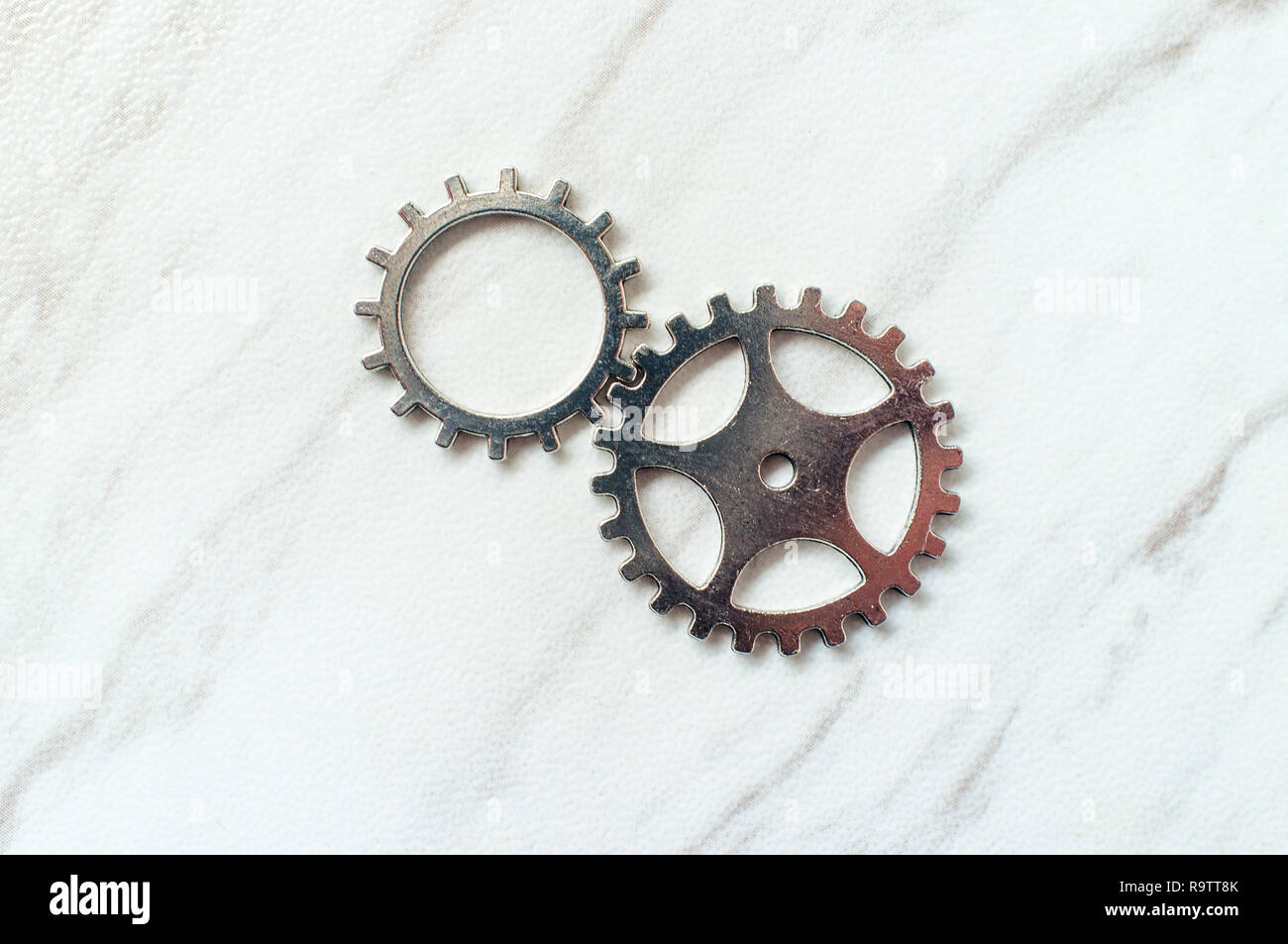 Two gears in motion symbolic of inspiration metaphor concept Stock Photo Alamy