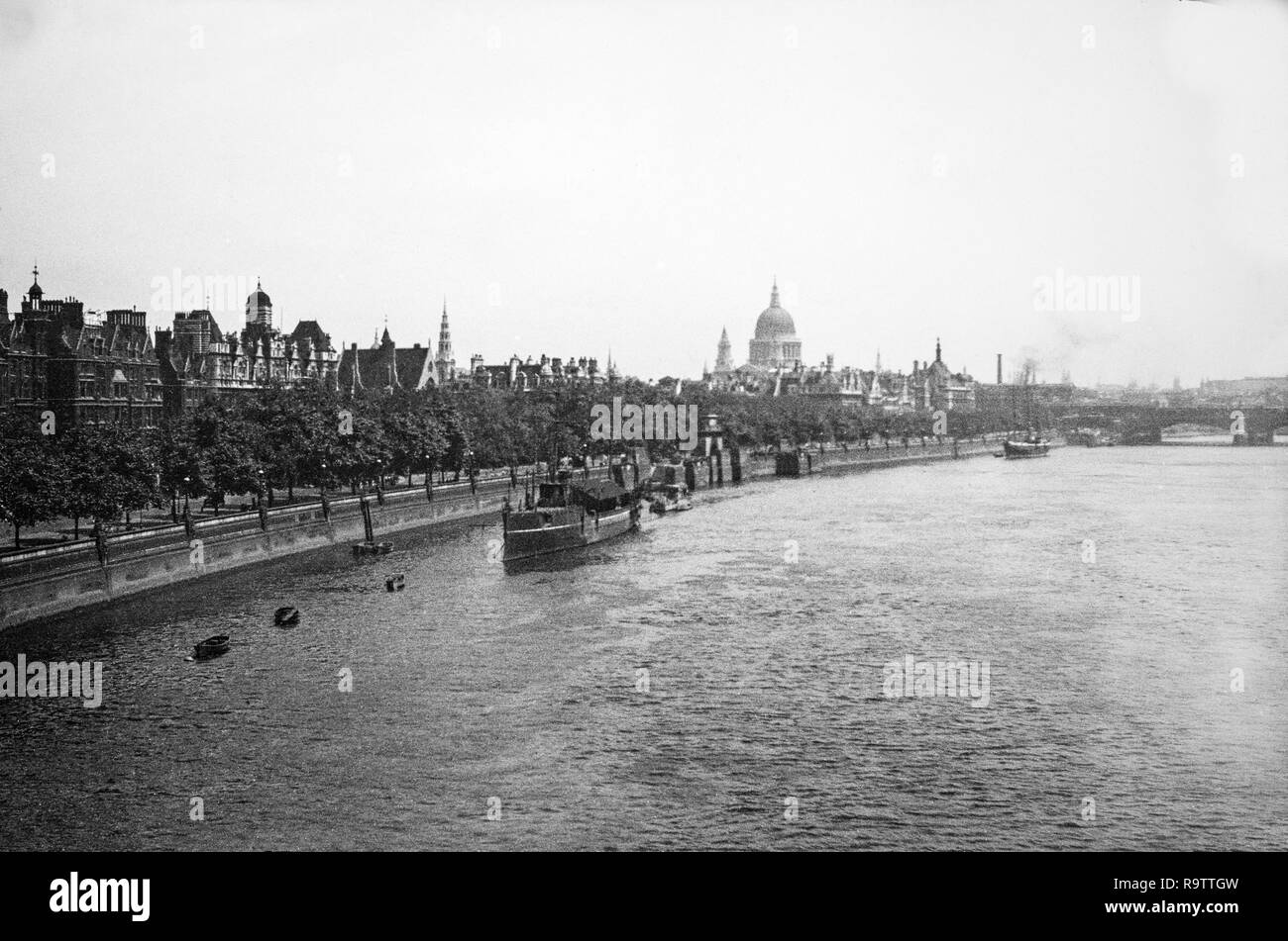 View of the River Thames in London, taken in 1919. View is looking East with Saint Pauls Cathedral visible on the skyline. Stock Photo