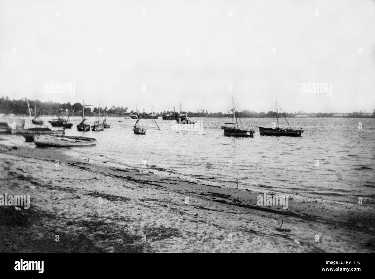 Early twentieth century black and white photograph showing boats in the harbour at Dar Es Salaam in east Africa. Stock Photo