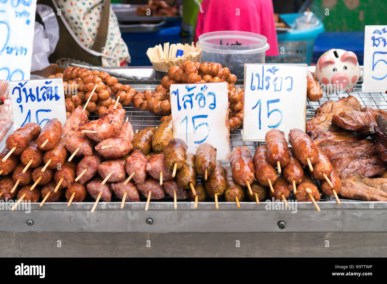 Street Food in Phuket, Thailand - Fried meats with sticks, Thai style food Stock Photo