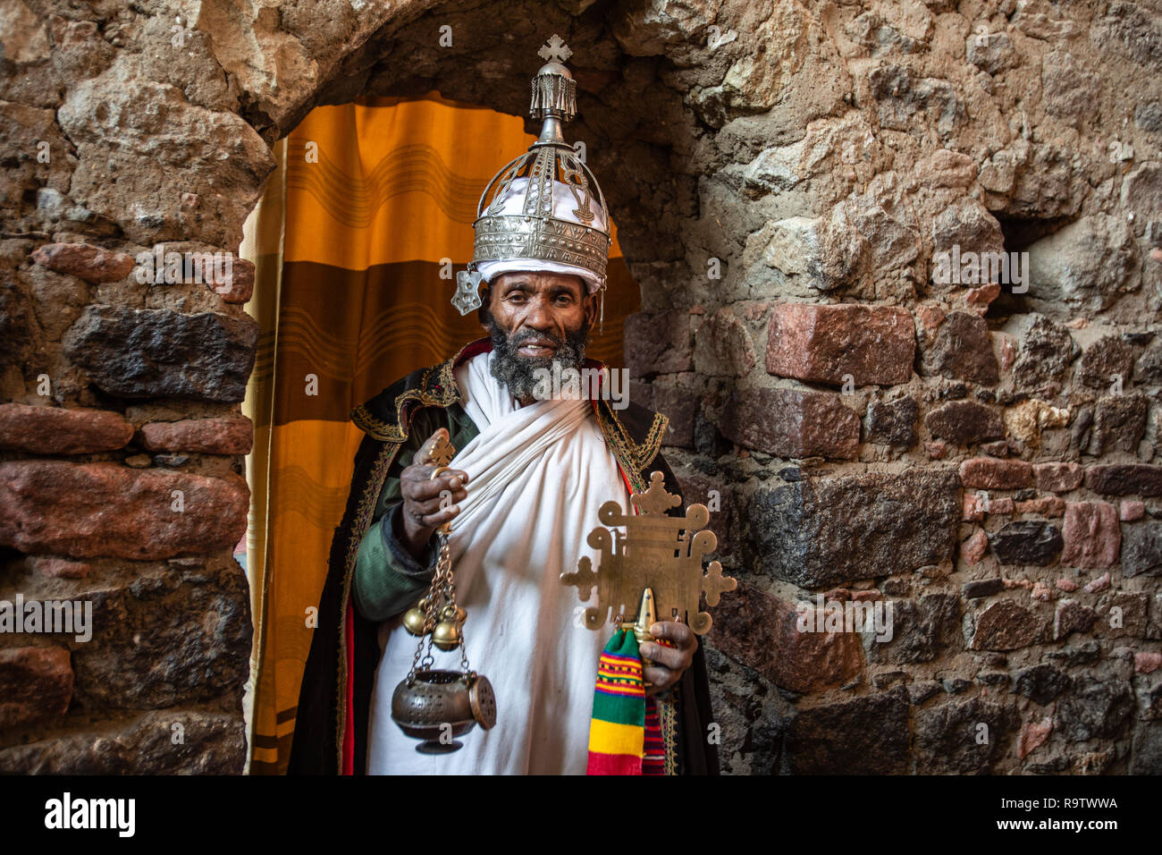 Priests at the rock-cut churches of Lalibela, Ethiopia Stock Photo