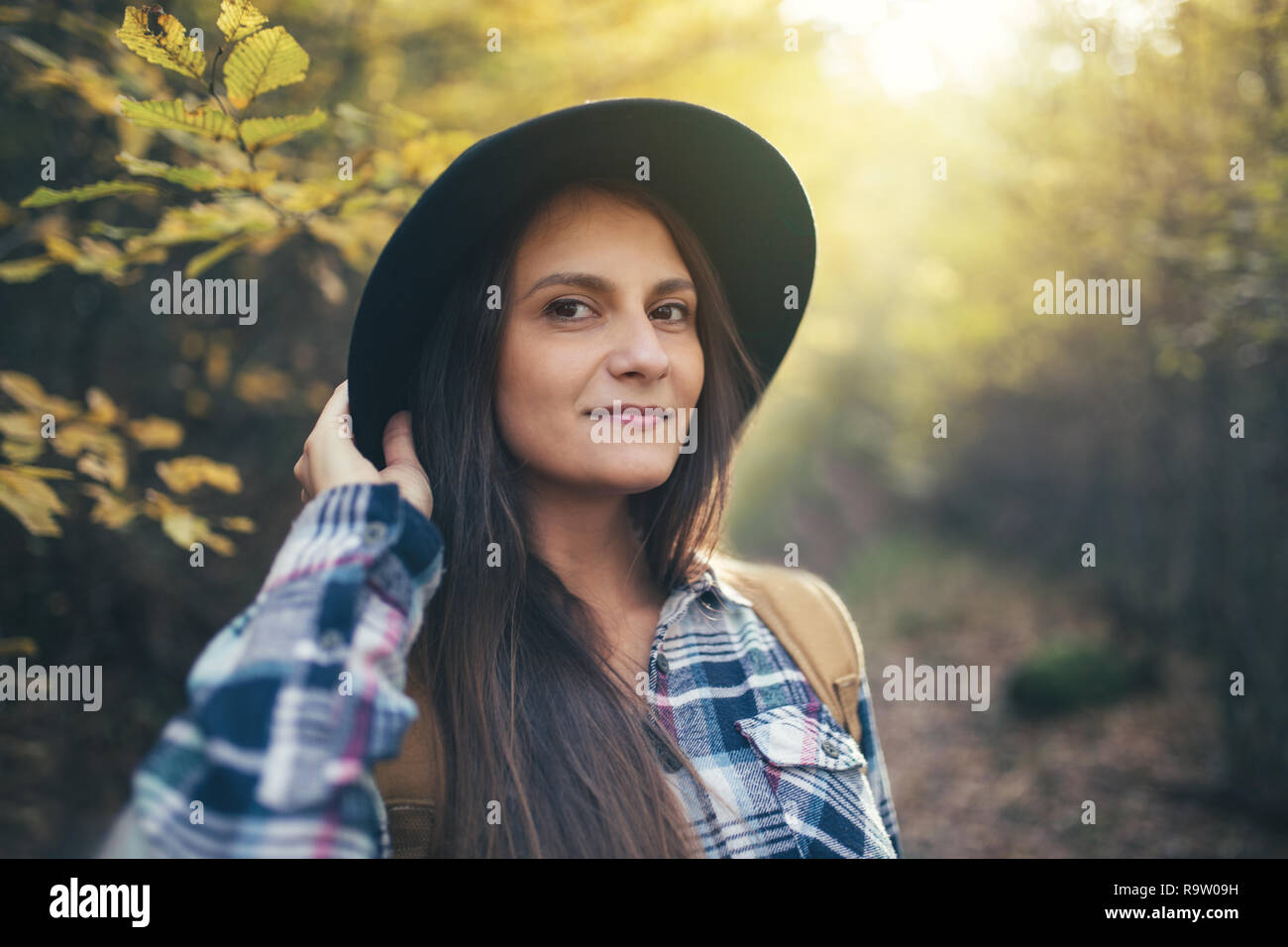 Portrait of pretty young woman in the woods Stock Photo - Alamy