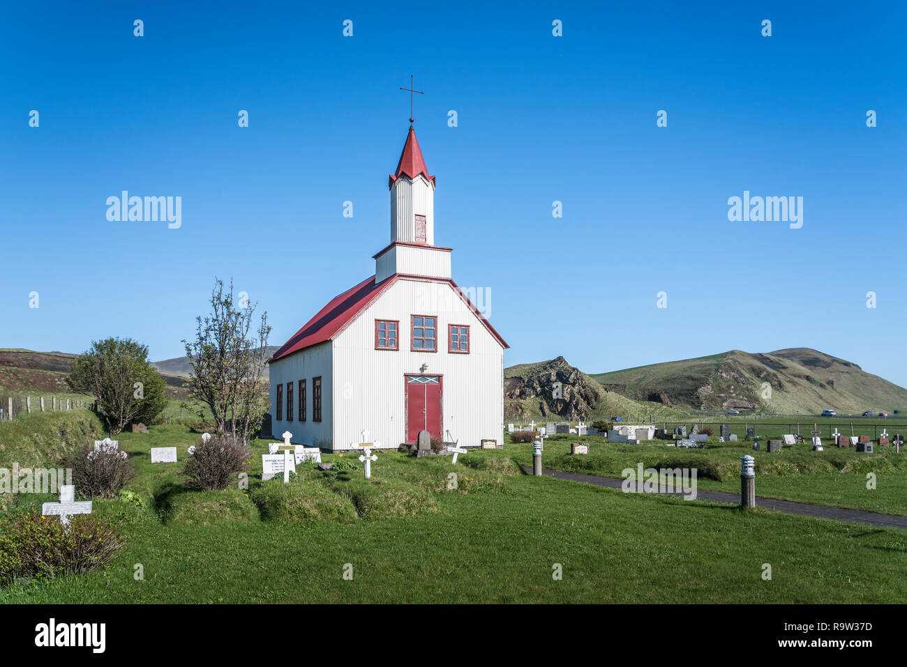 The red roofed The Skeidflatarkirkja Church, Dyrholaey, Myrdalur, Iceland. Stock Photo