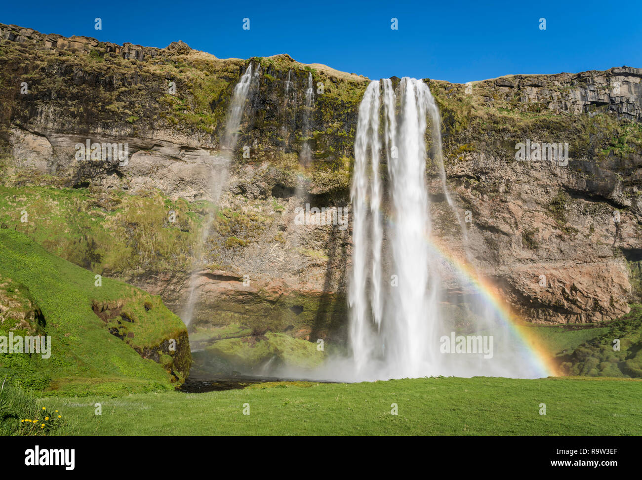 The Seljalandsfoss waterfall with rainbow in southern Iceland, Europe ...