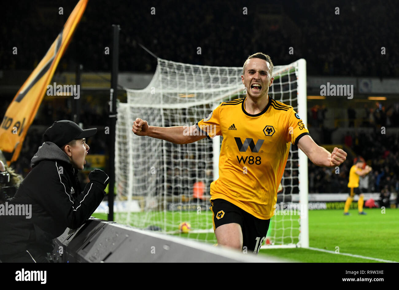 Footballer Diogo Jota celebrating a goal with young fan cheering him Stock Photo