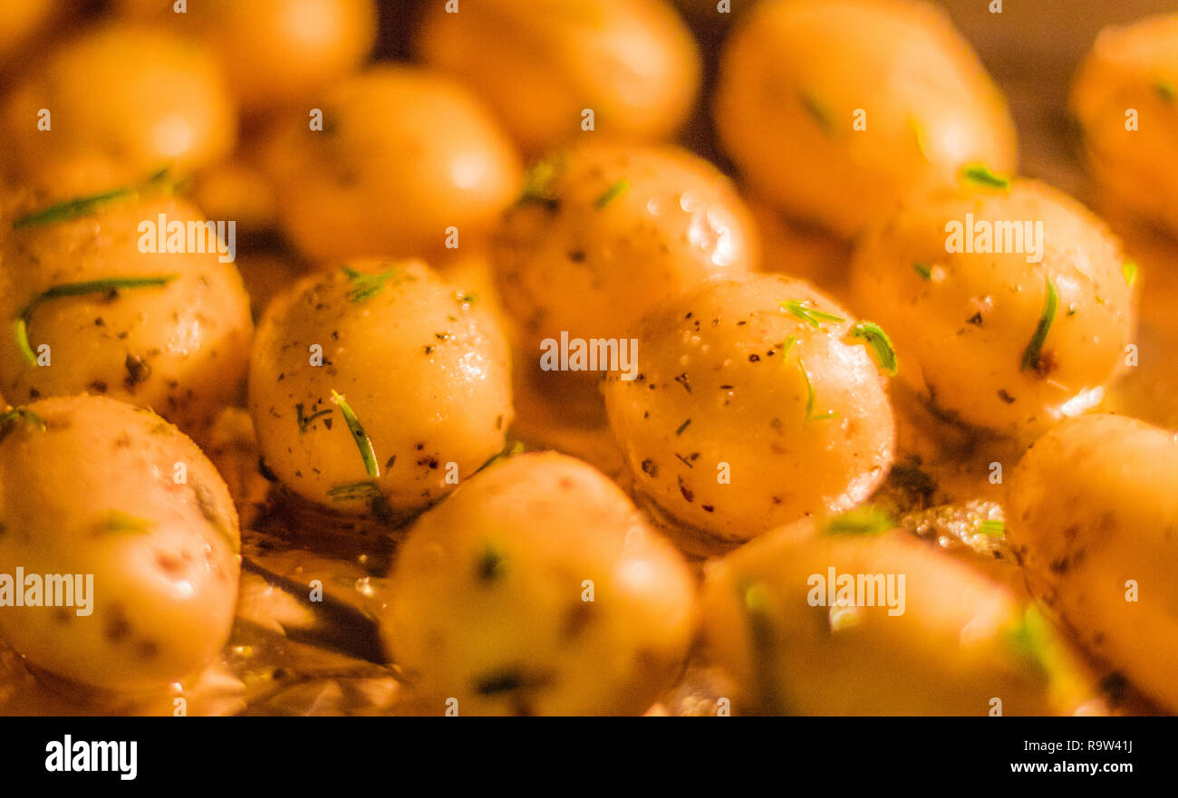 rustic food and homemade cooking styled concept - roasted potatoes in ...