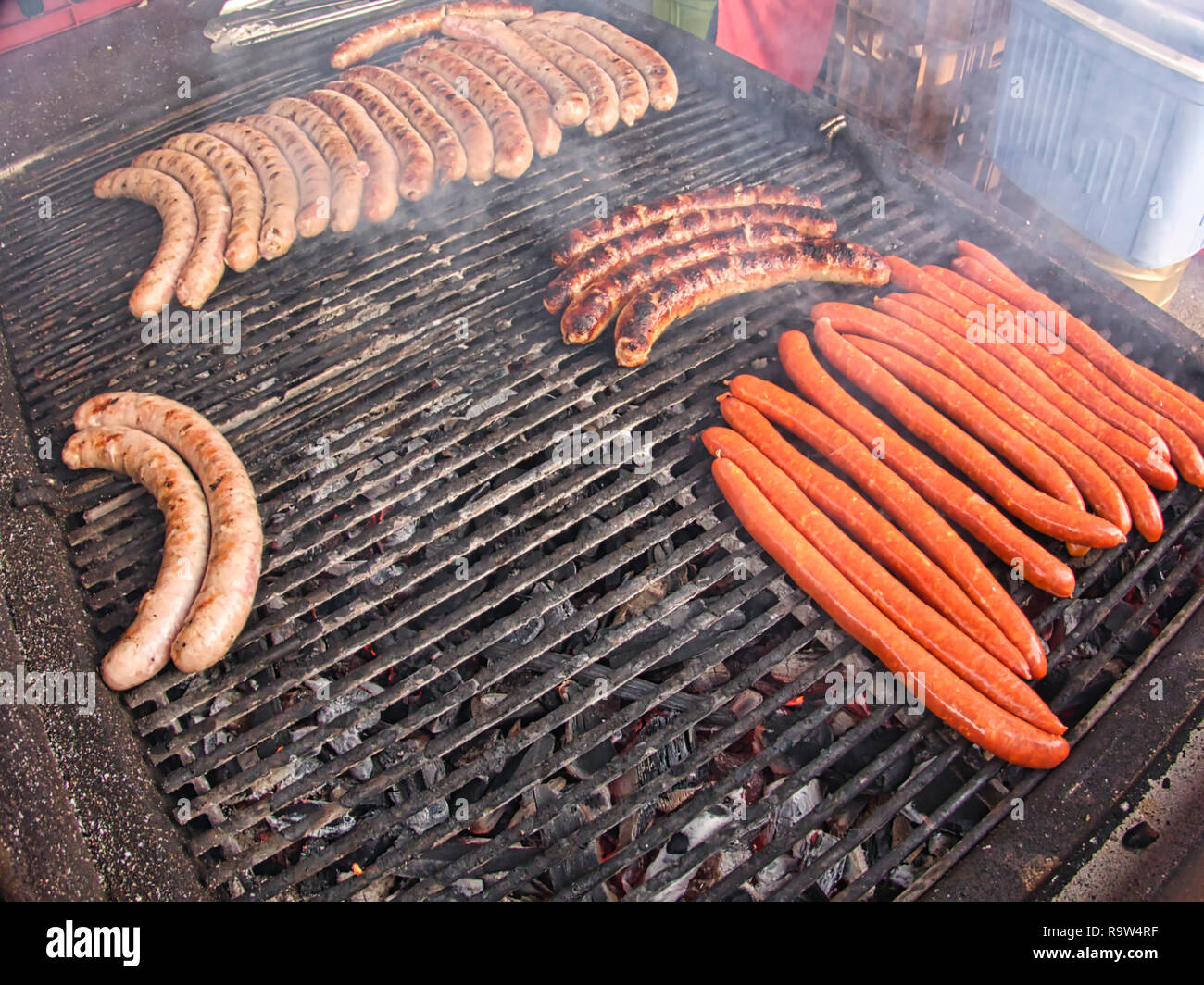 Frying fresh meat barbecue sausages merguez brats, BBQ picnic sandwich