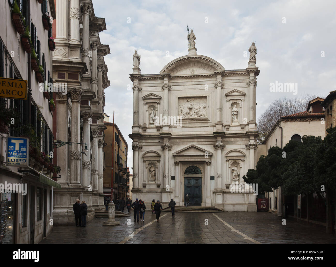 Church of Saint Roch (Chiesa di San Rocco) with a facade designed by Italian Baroque architect Bernardino Maccarucci and built between 1765 and 1771 in Venice, Italy. The building of Scuola Grande di San Rocco is seen at the left. Stock Photo