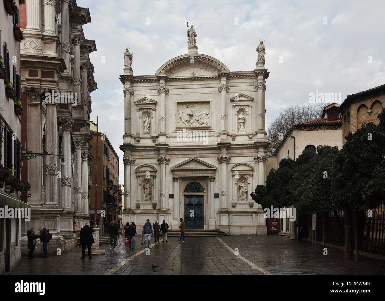 Church of Saint Roch (Chiesa di San Rocco) with a facade designed by Italian Baroque architect Bernardino Maccarucci and built between 1765 and 1771 in Venice, Italy. The building of Scuola Grande di San Rocco is seen at the left. Stock Photo