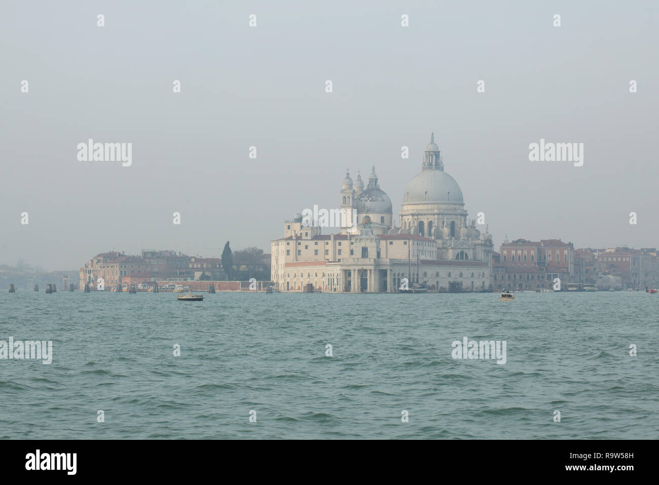 Basilica of Santa Maria della Salute (Basilica di Santa Maria della Salute) and the Venetian Lagoon (Laguna di Venezia) in Venice, Italy, pictured from a boat. Stock Photo