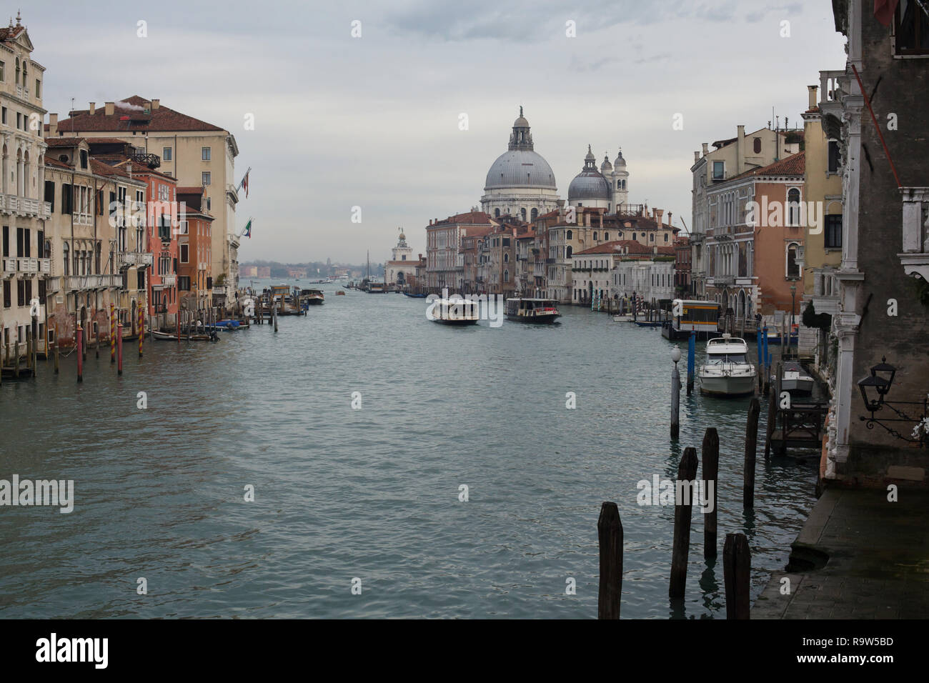 Basilica of Santa Maria della Salute (Basilica di Santa Maria della Salute) and the Grand Canal (Canal Grande) in Venice, Italy, pictured from the Accademia Bridge (Ponte dell'Accademia). Stock Photo