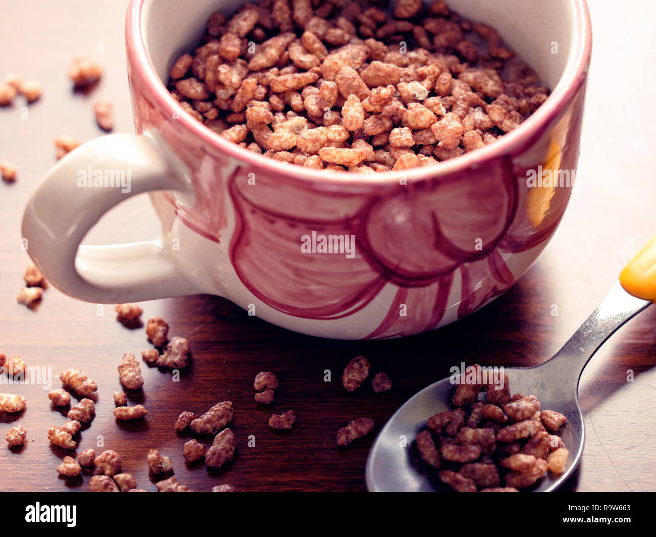 Mug filled chocolate cereals breakfast closeup Stock Photo