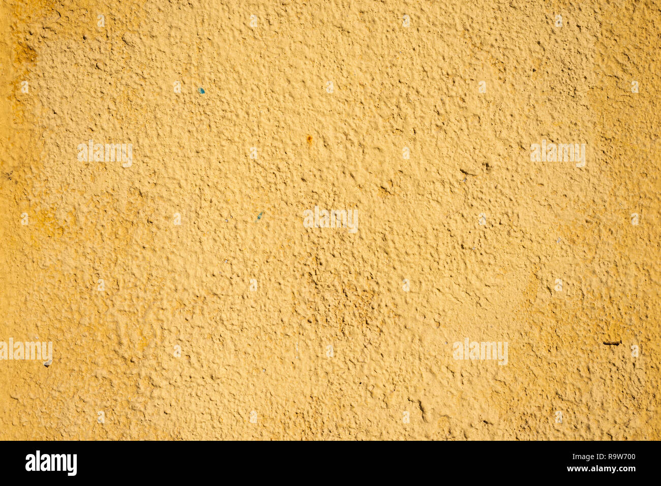 highly detailed yellow color stucco wall background Stock Photo