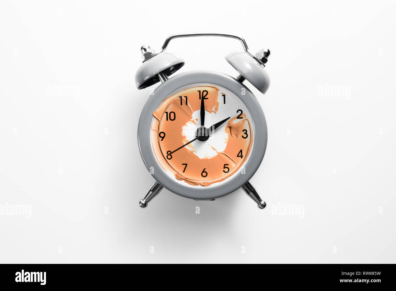 Alarm clock with tone cream instead of the dial. Stock Photo