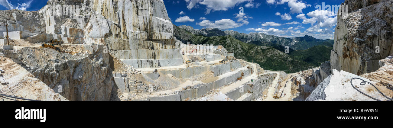 High stone mountain and marble quarries in the Apennines in Tuscany,  Carrara Italy. Open marble mining. Stock Photo