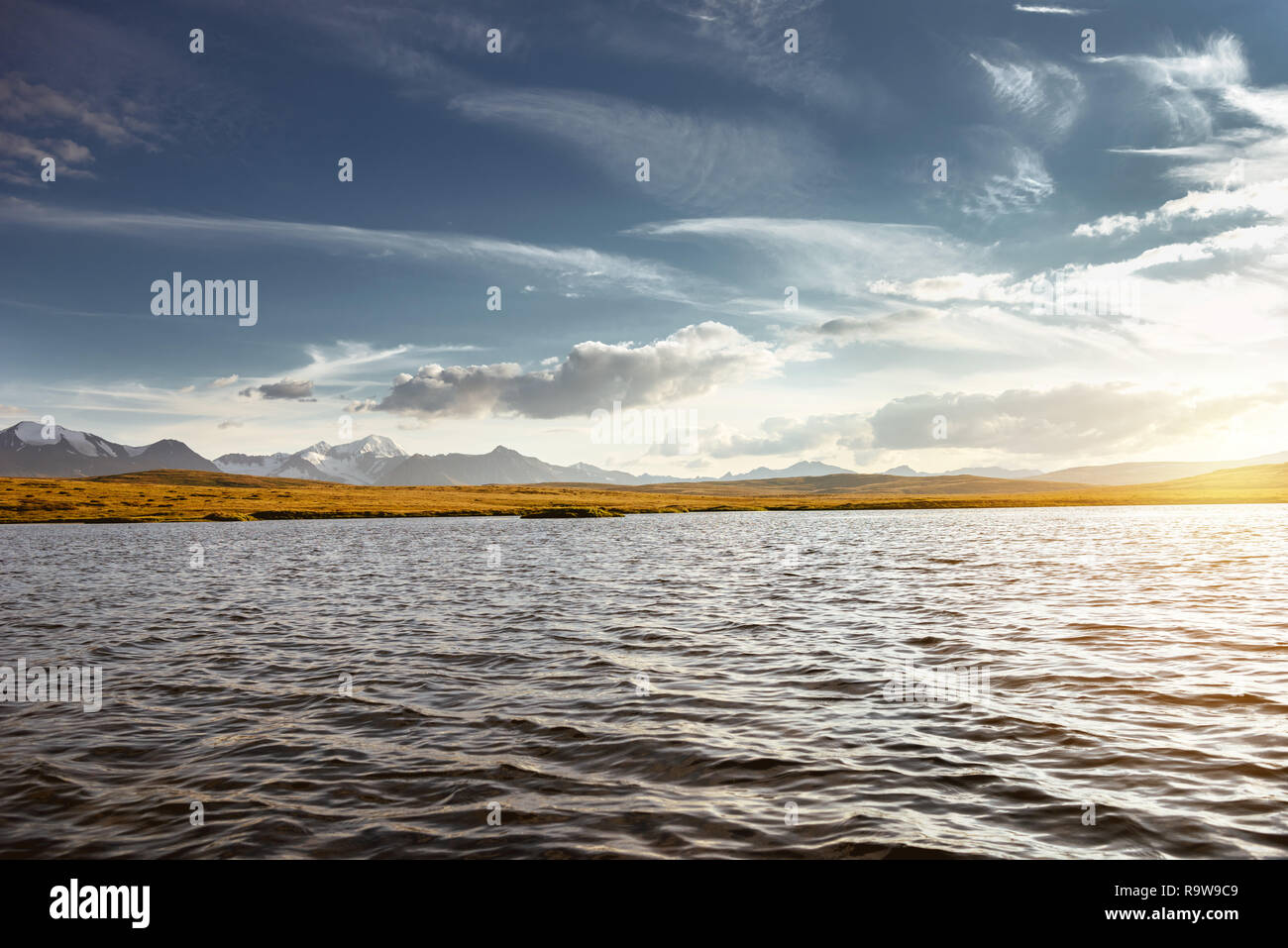 Beautiful mountains landscape with big lake and snowcapped mountains on ...