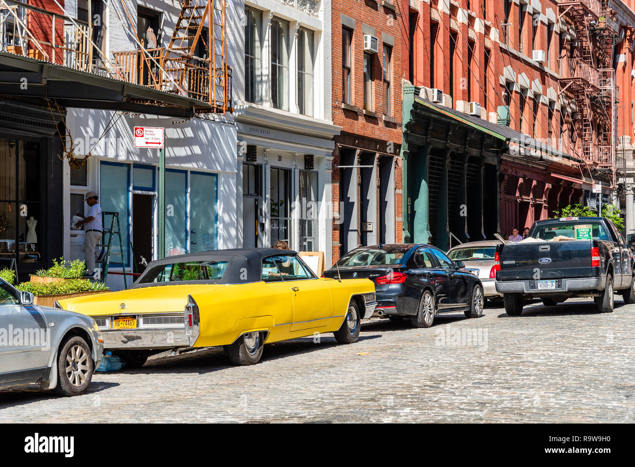 New York City, USA - June 25, 2018: Street scene with classic yellow Cadillac Eldorado convertible car in Tribeca District of Manhattan a sunny day of Stock Photo