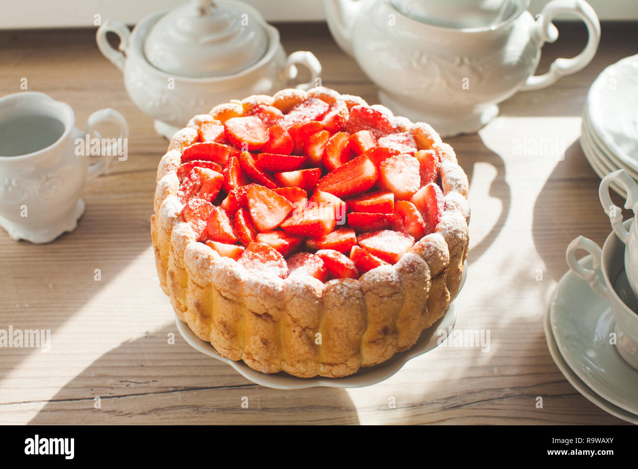 French Fresh Strawberry charlotte sweet cake in the kitchen Stock Photo