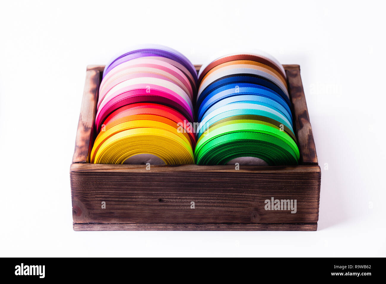 Multi Ribbon Bobbin ribbon bobbins in box isolated on white Stock Photo - Alamy