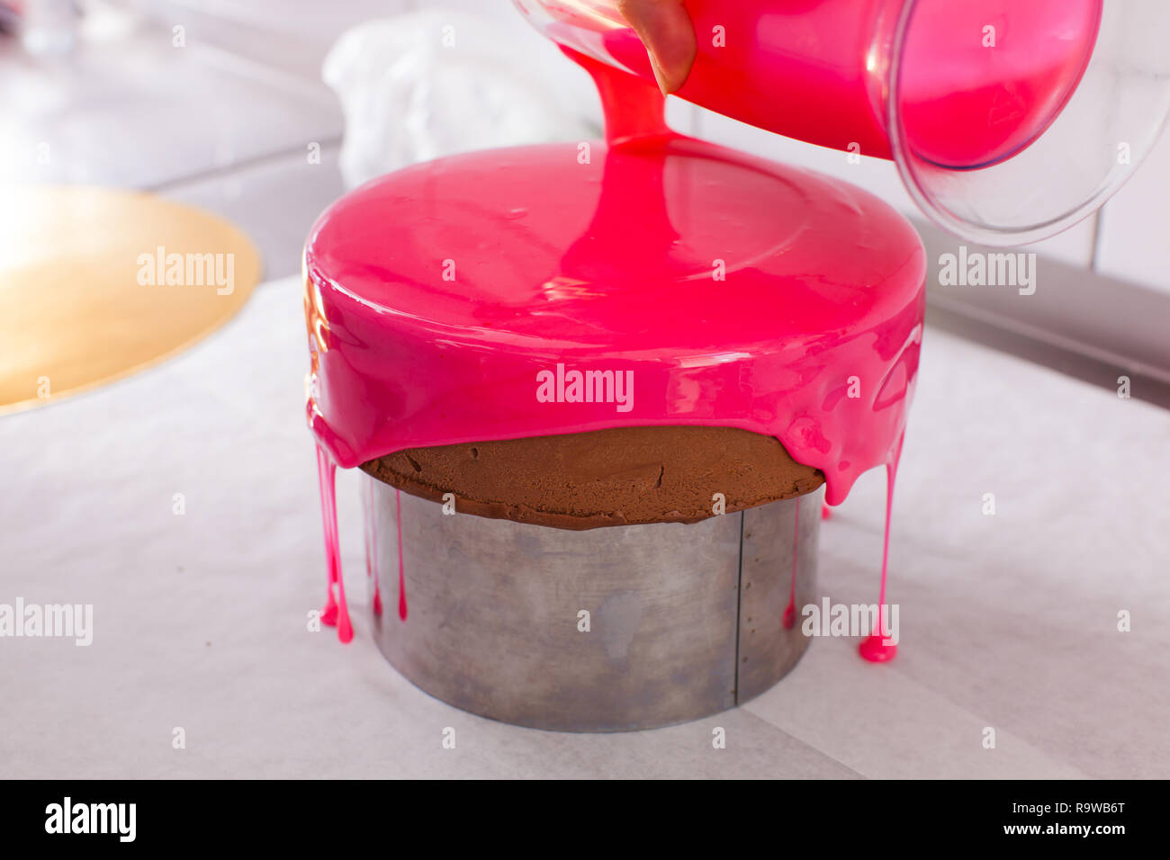 Process of decorating cake with mirror glaze Stock Photo Alamy