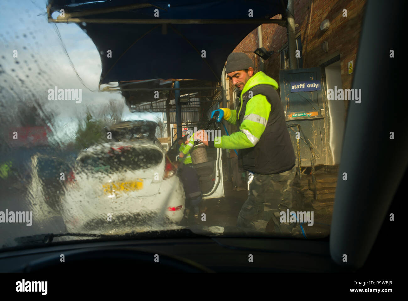 Car Wash in Saffron Walden Essex England UK. December 2018 Men from Moldava and Romania washing cars. Stock Photo