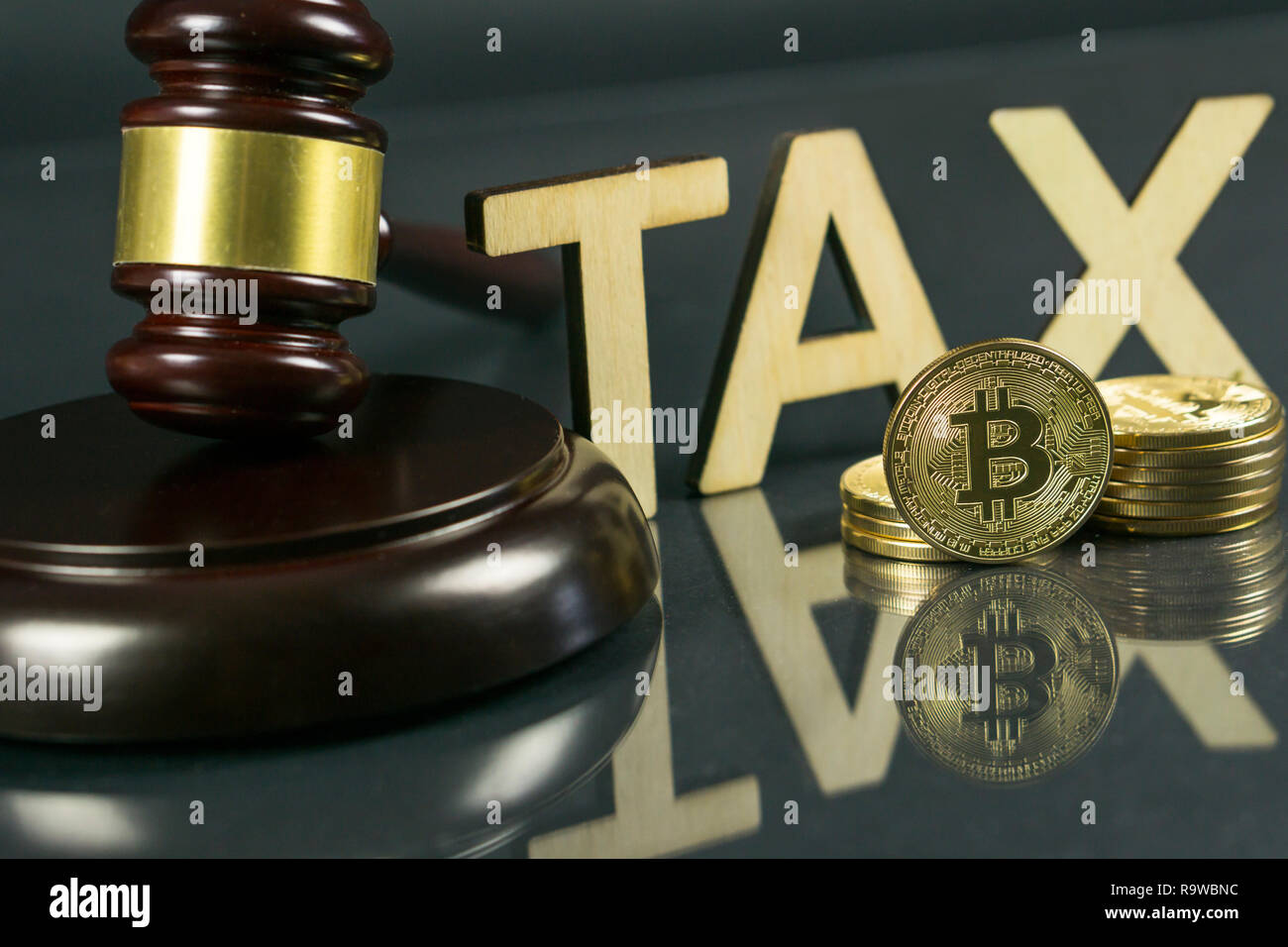 Gavel and cryptocurrency. Government regulation concept. Tax payment